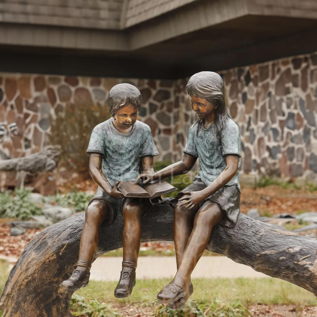 Boy and Girl on Log Reading Statue