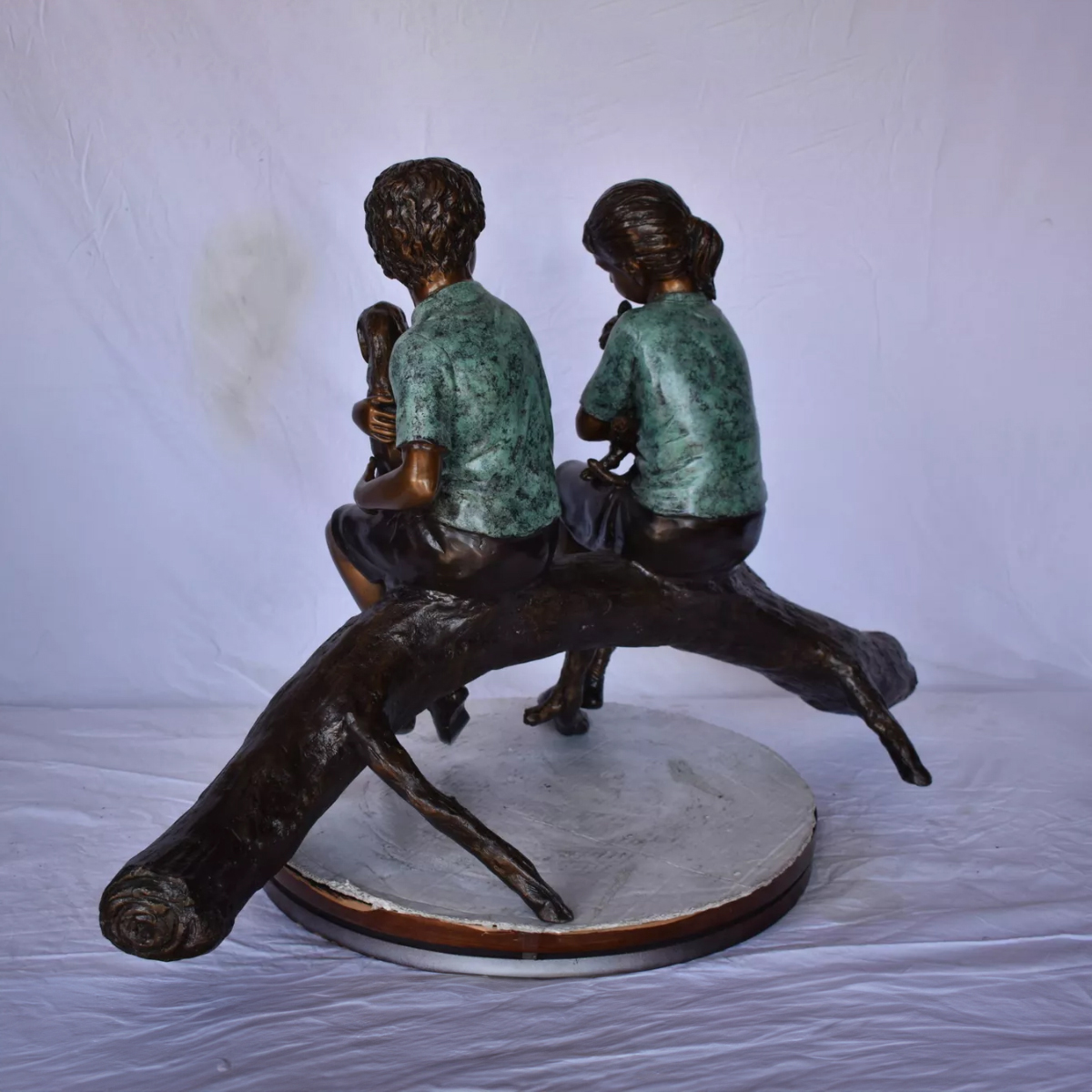 Boy and Girl on Log Statue Sitting