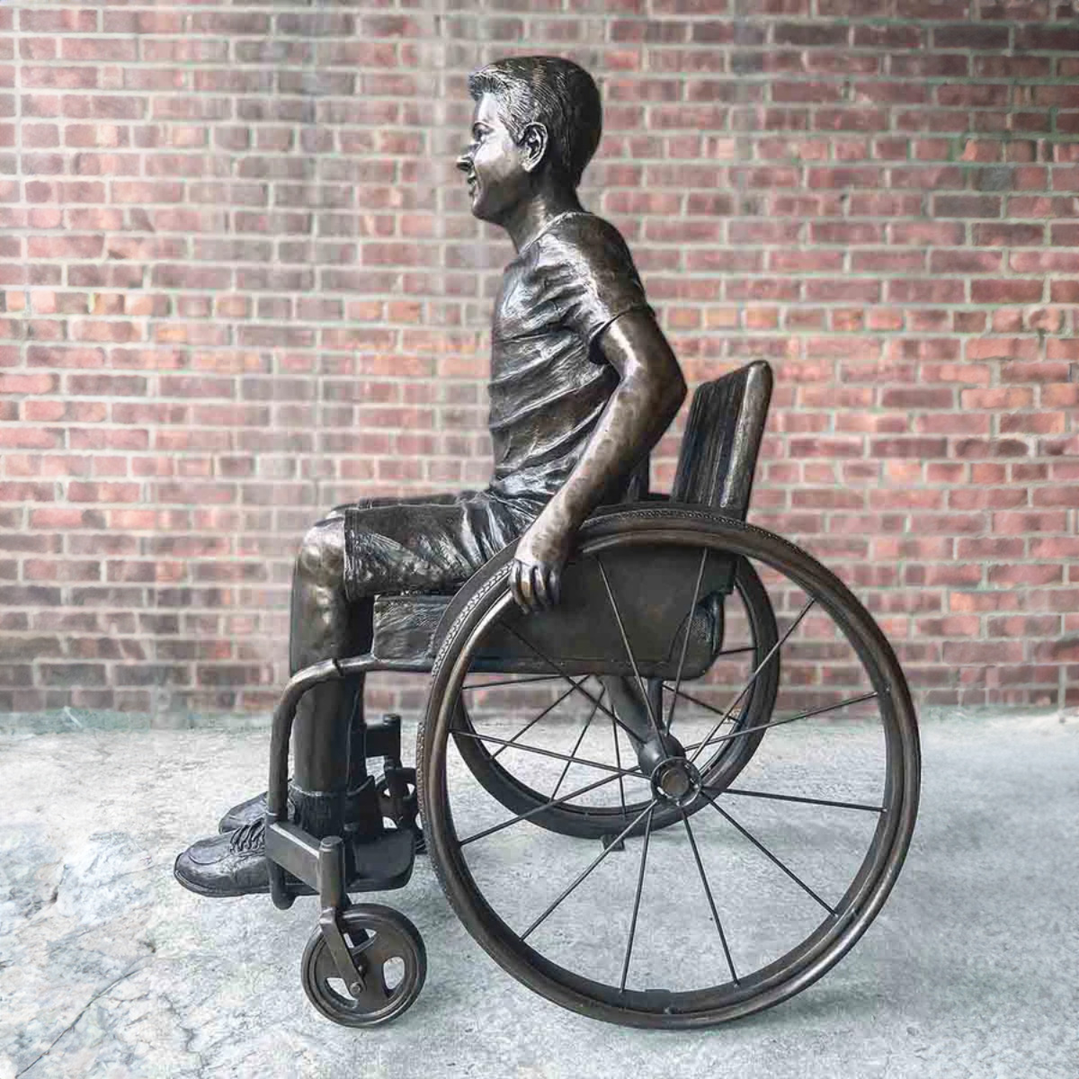 Boy in His Wheelchair Statue