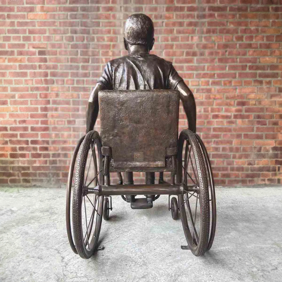 Boy in His Wheelchair Statue