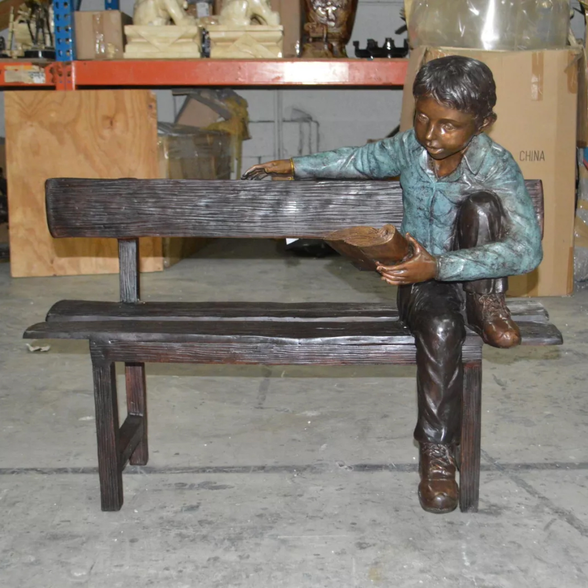 Boy on Bench Reading Sculpture