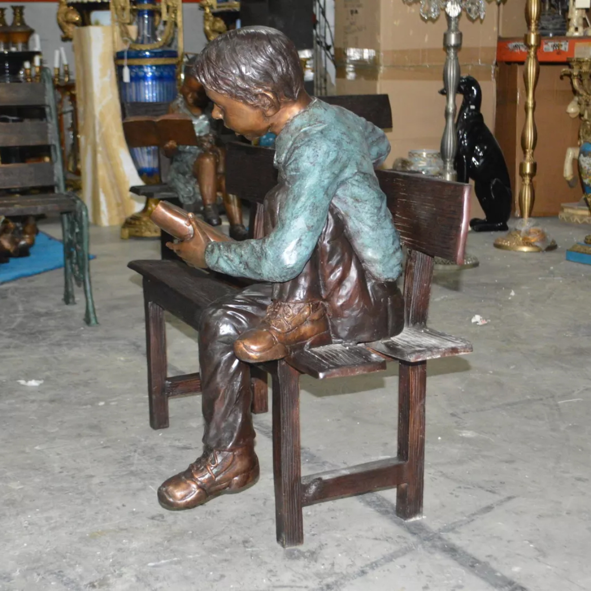 Boy on Bench Reading Sculpture