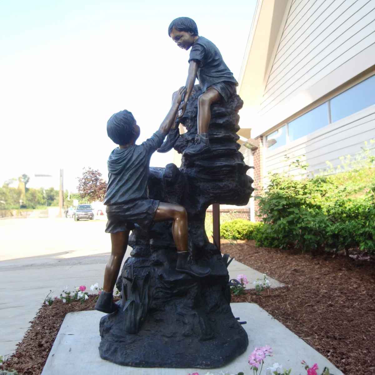 Boys Climbing Mountain Statue