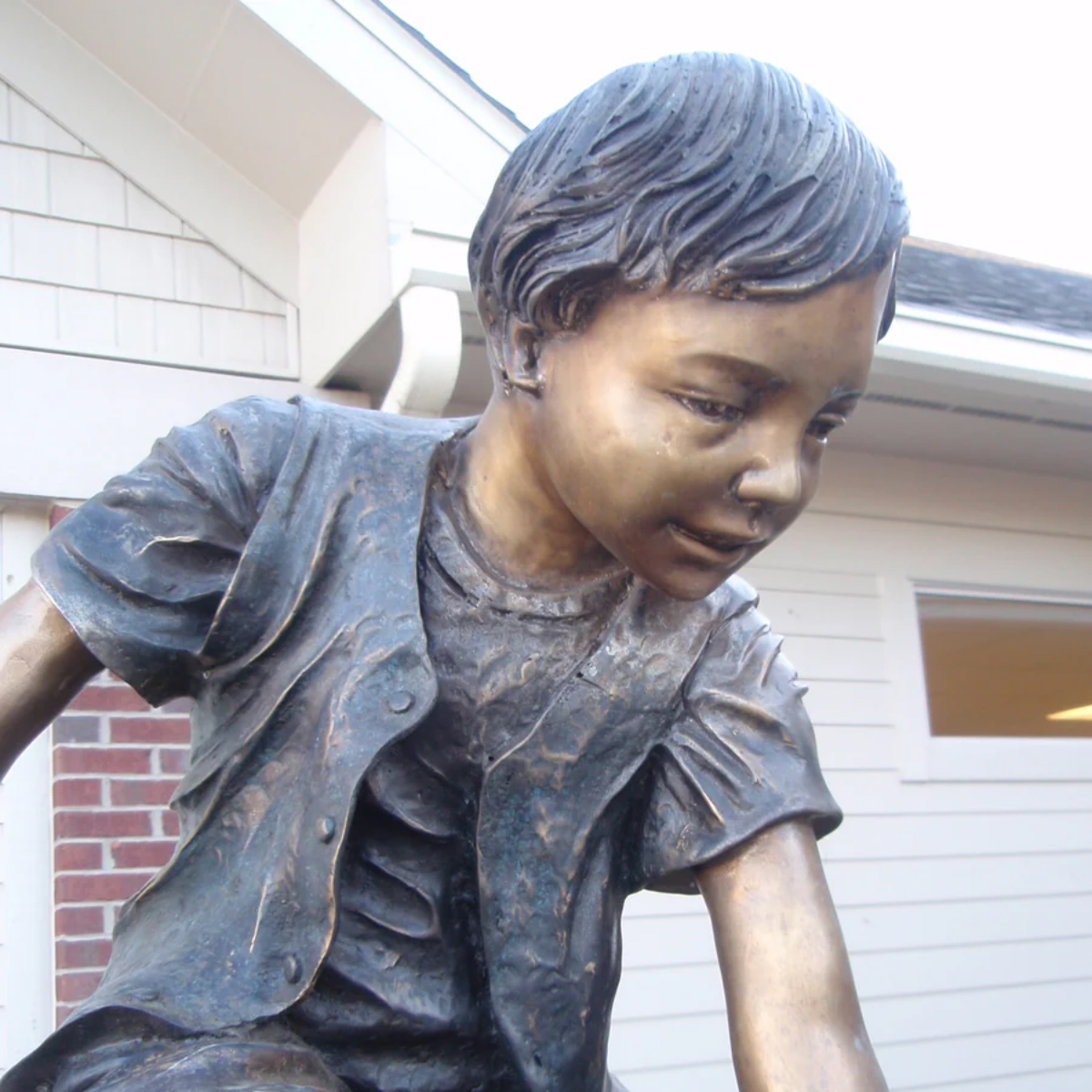 Boys Climbing Mountain Statue