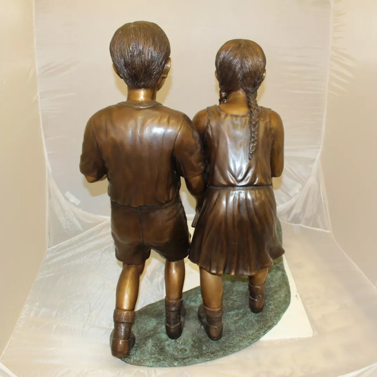 Bronze Children Walking Dog