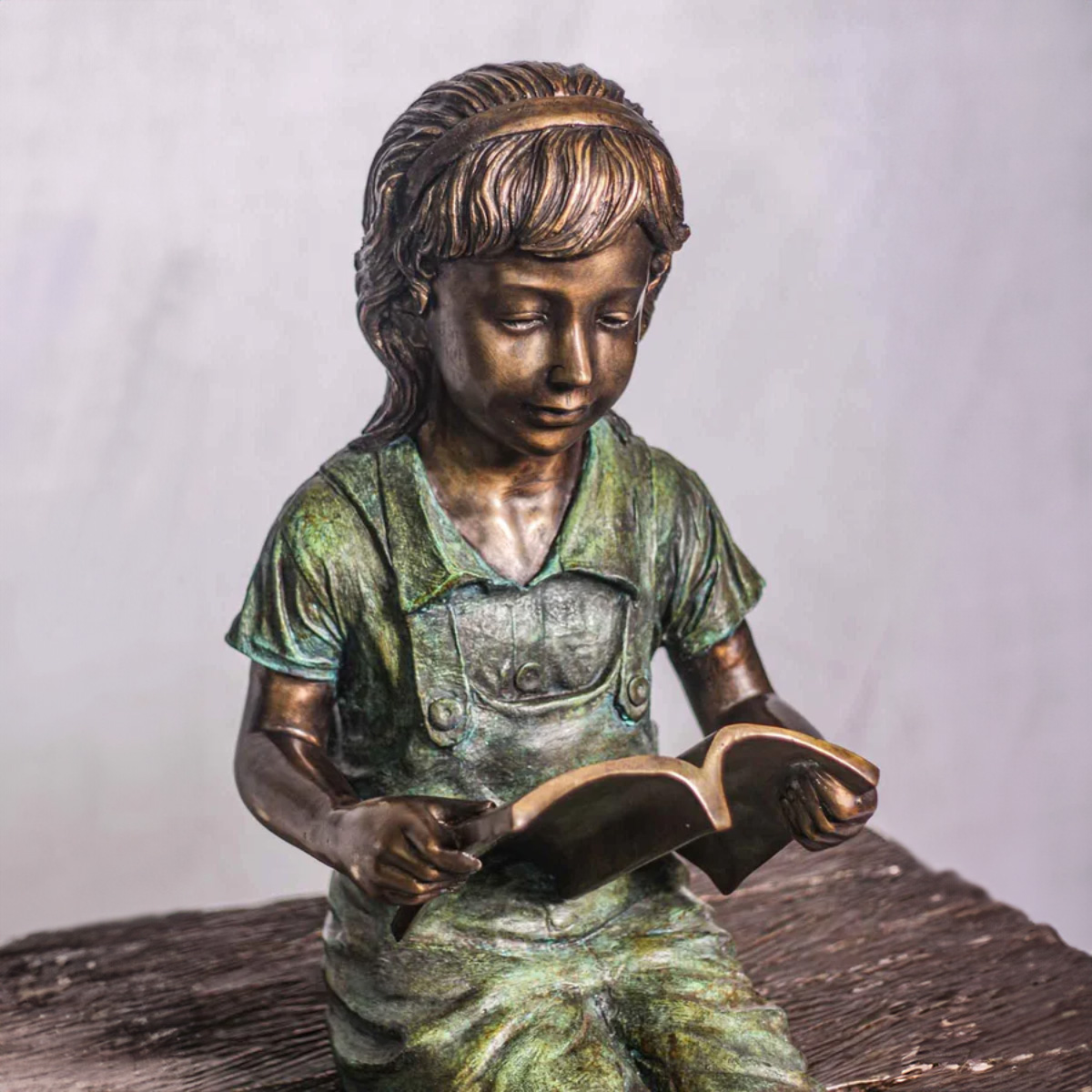 Bronze Girl Reading on Bench Statue