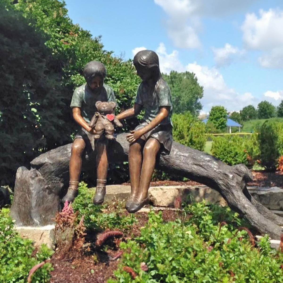 Bronze Kids Holding Doll Statue