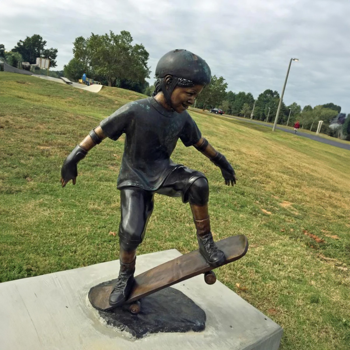 Children Playing on Skateboard Statue