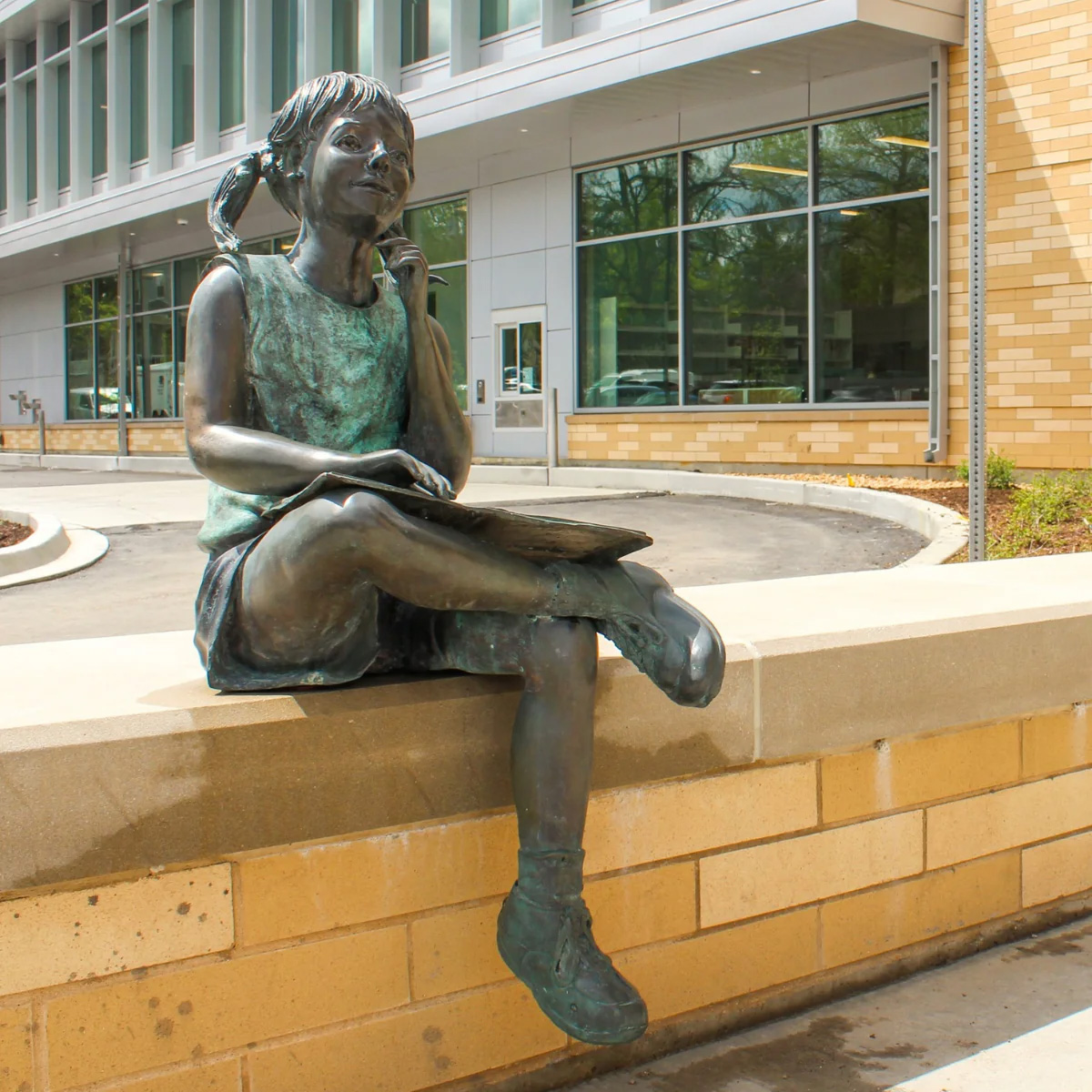 Girl Sitting with Book Statue