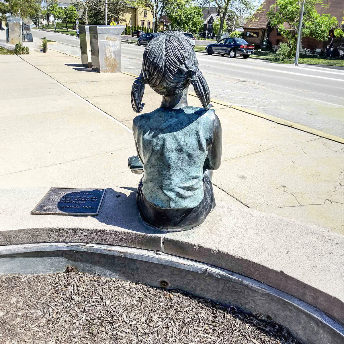 Girl Sitting with Book Statue