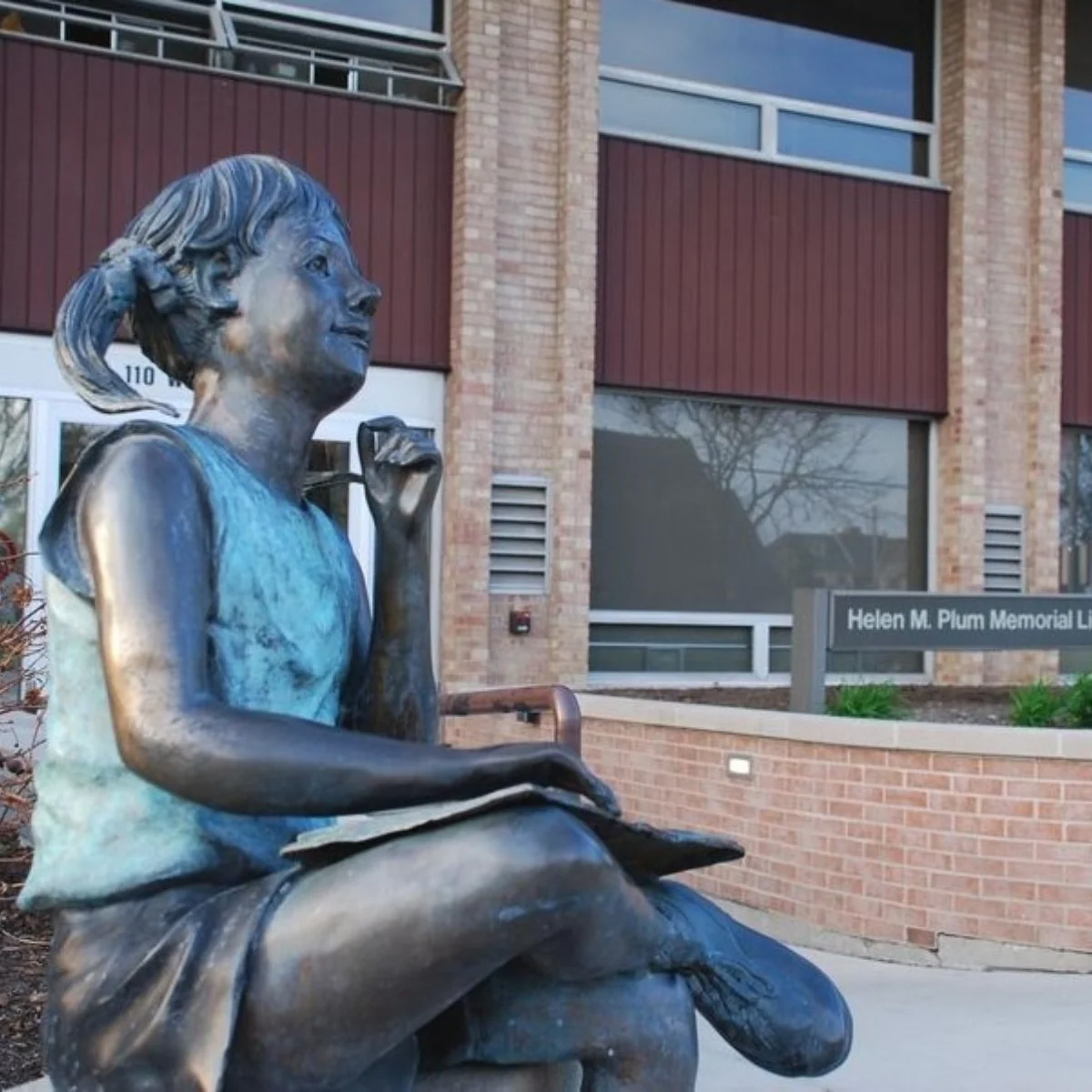 Girl Sitting with Book Statue