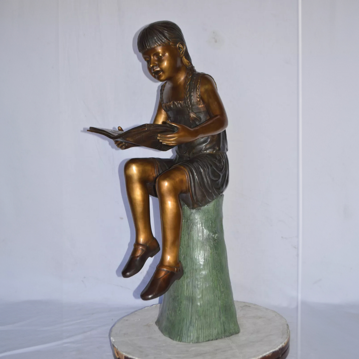 Girl on a Stump Reading Statue