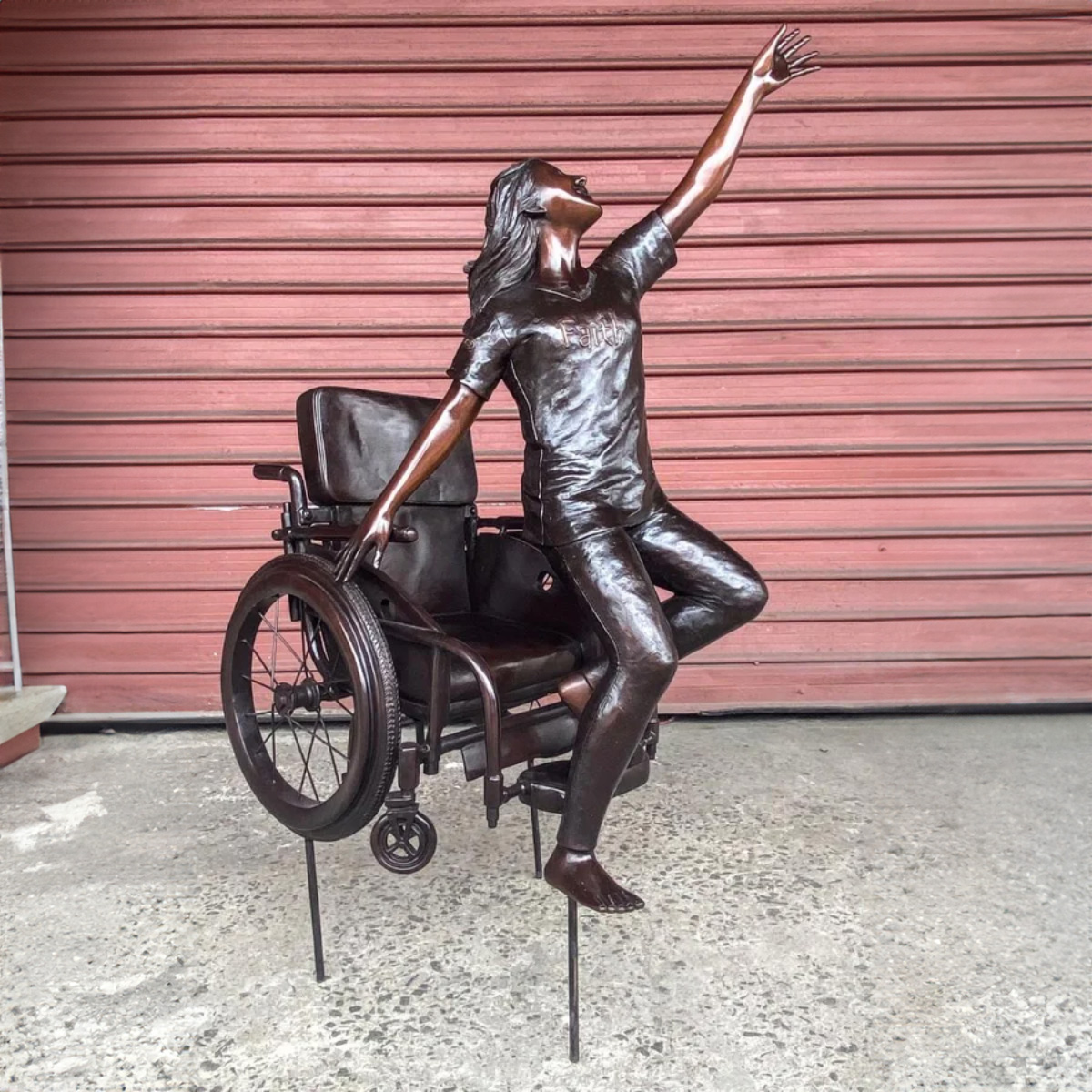 Girl up on Wheelchair Statue