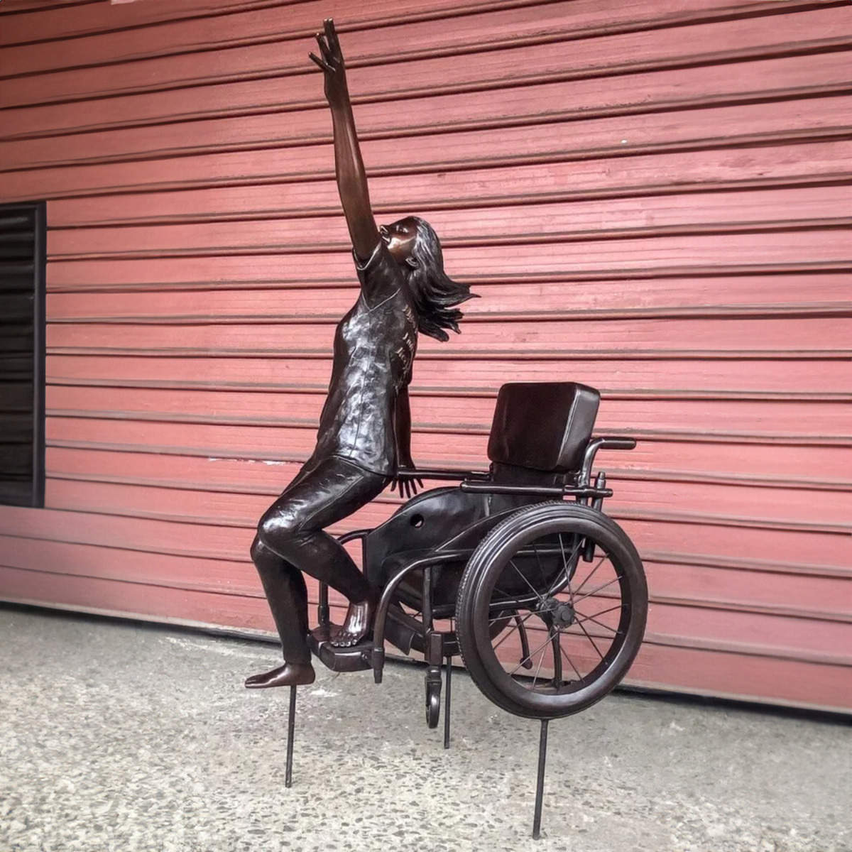 Girl up on Wheelchair Statue