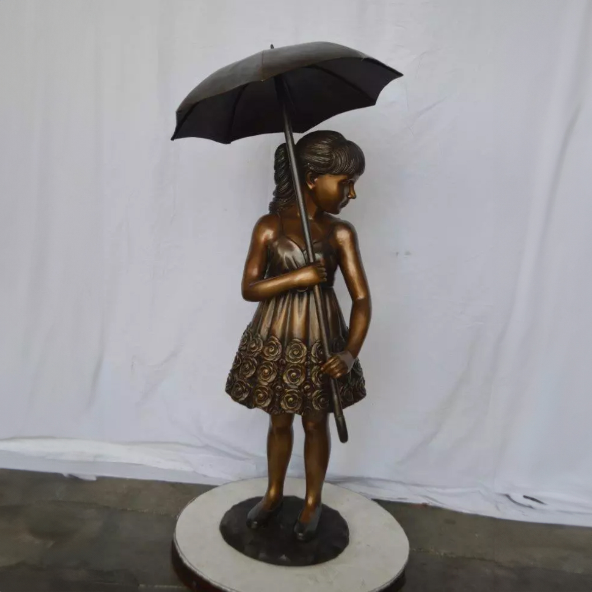 Girl with Umbrella Statue