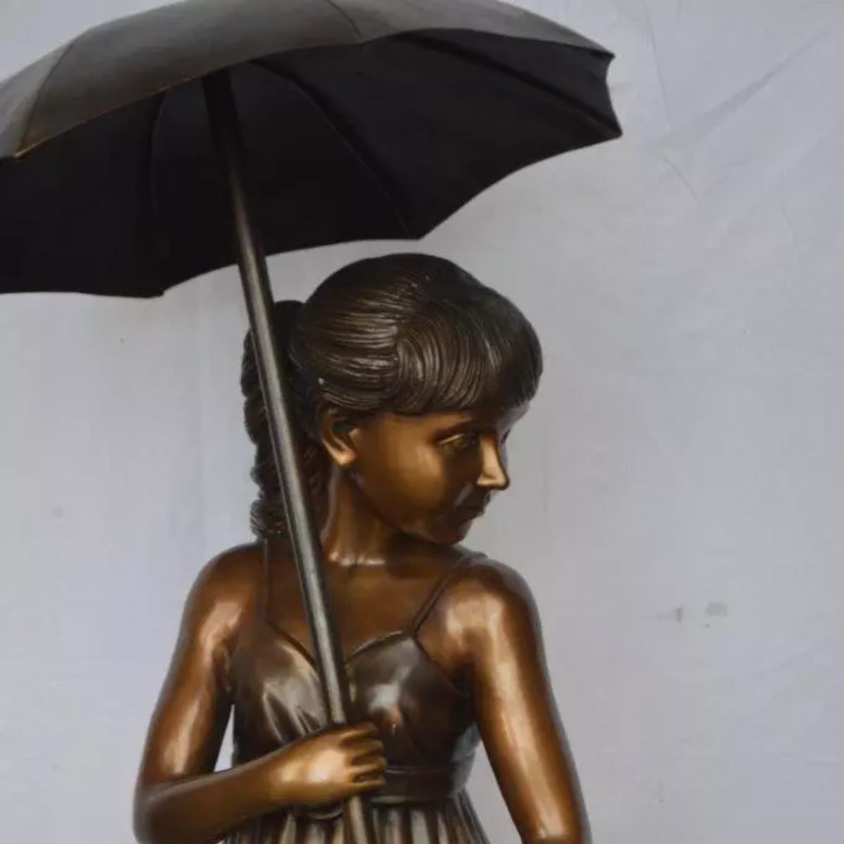 Girl with Umbrella Statue