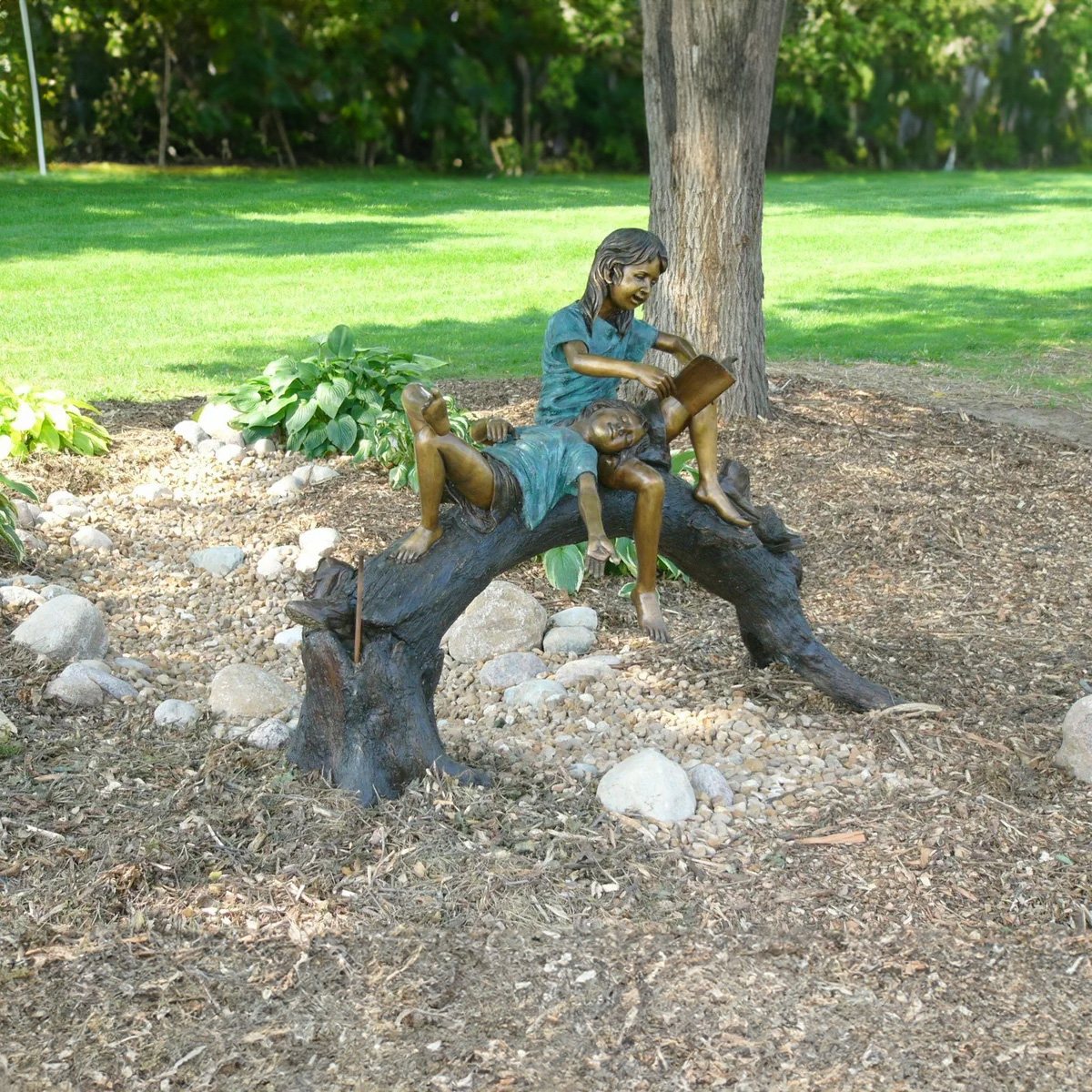 Girls on Log Reading Statue