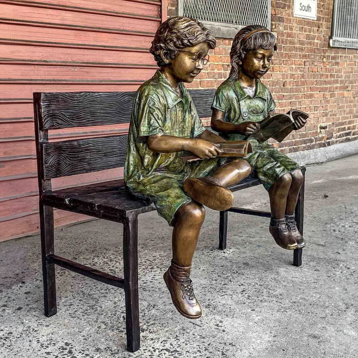 Kids Reading on Bench Statue