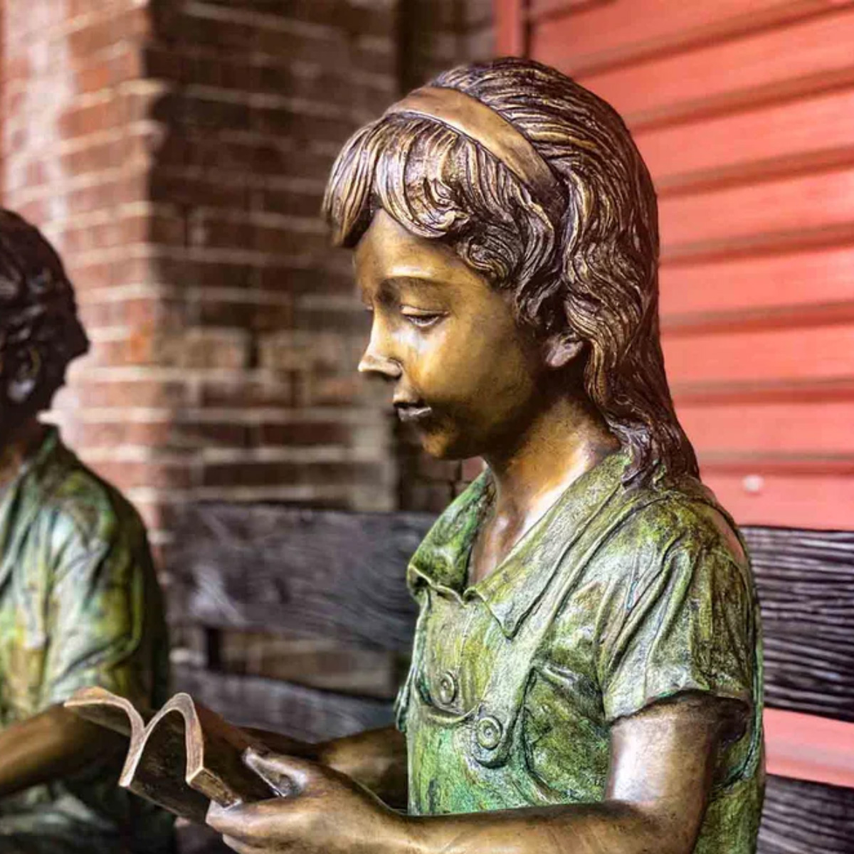 Kids Reading on Bench Statue