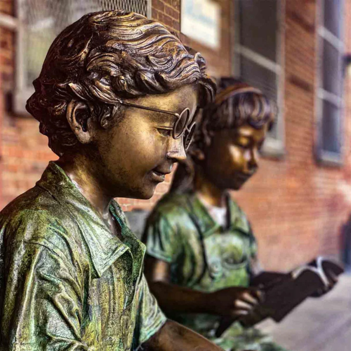 Kids Reading on Bench Statue