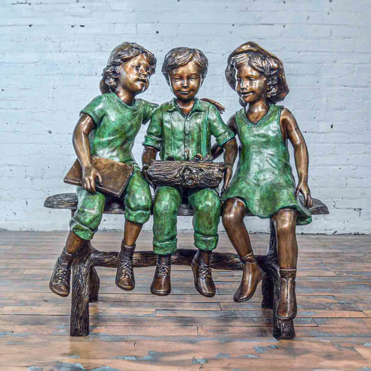 Three Children on Bench Sculpture