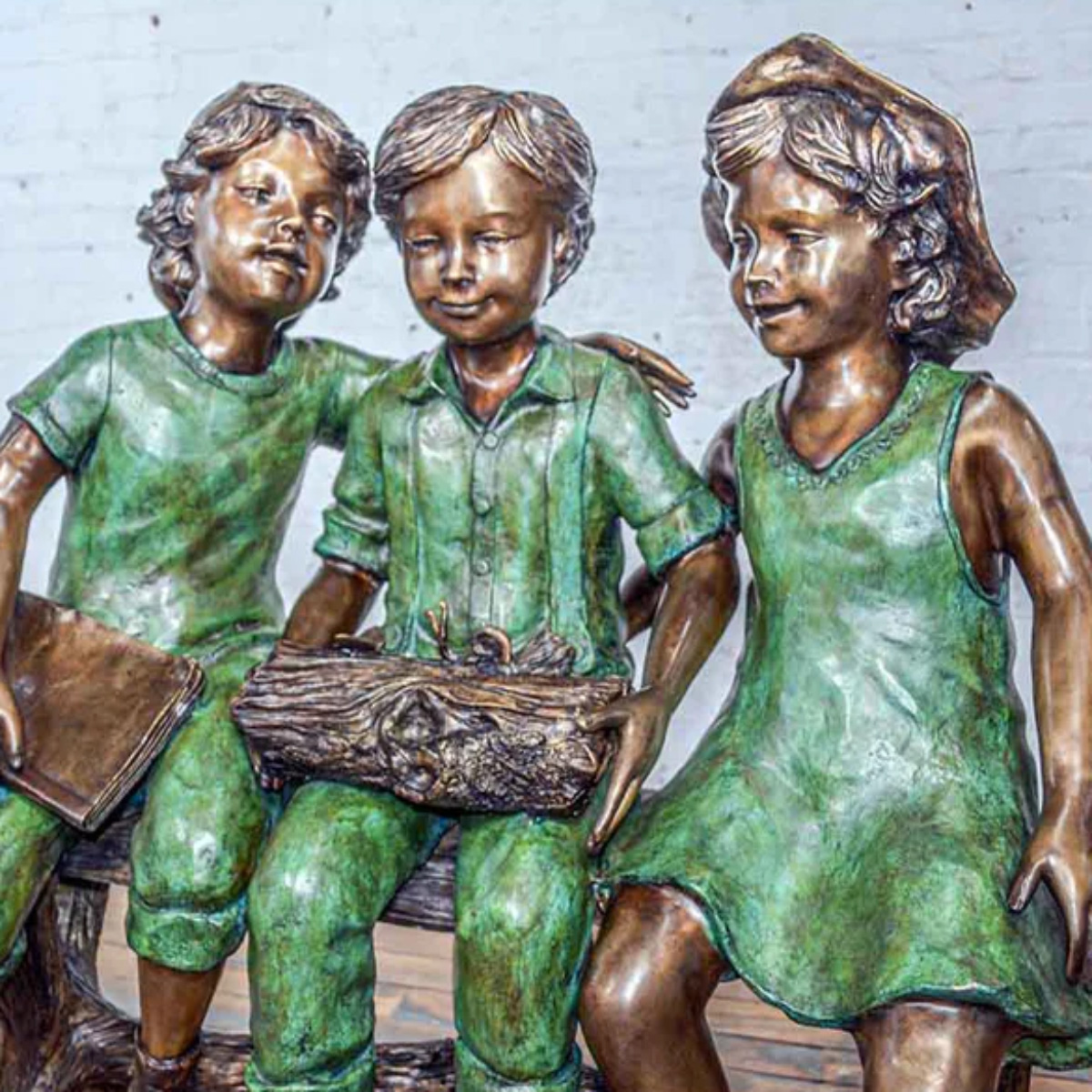 Three Children on Bench Sculpture