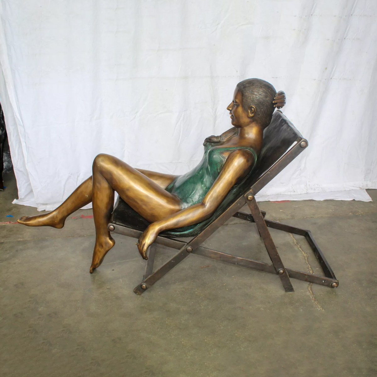 Woman Sitting in Chair Statue