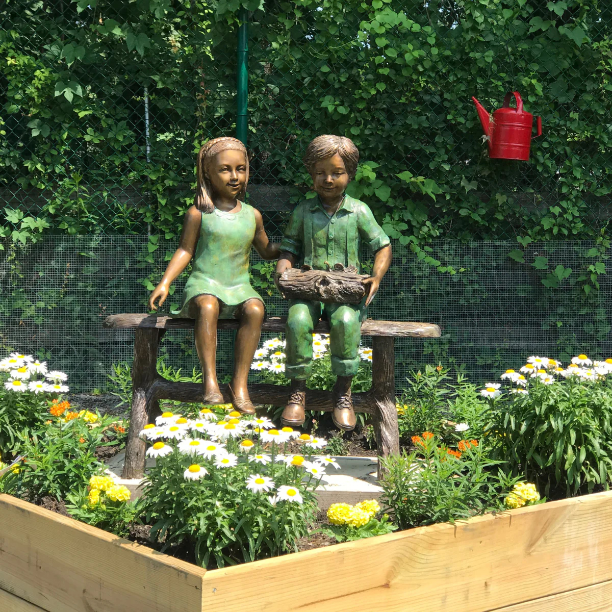 Young Friends on Bench Statue