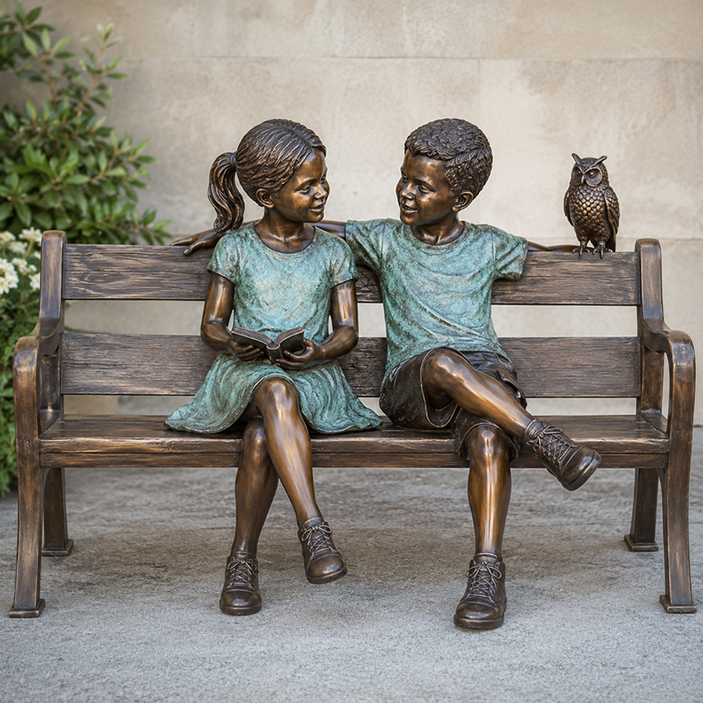Boy And Girl Sitting On Bench Statue