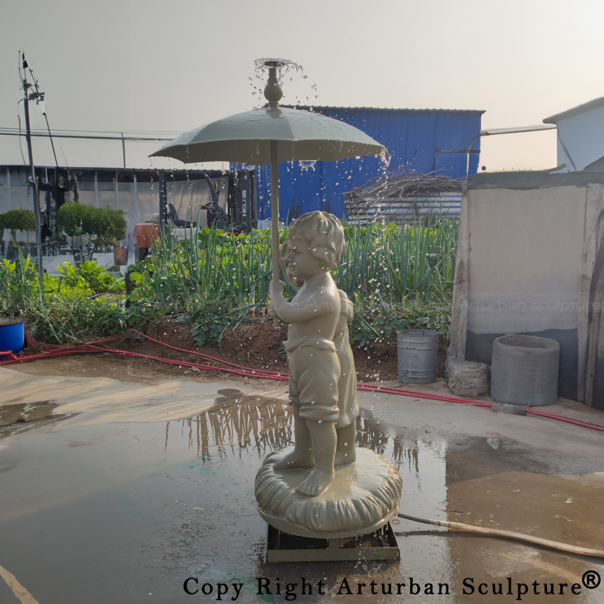 Girl and Boy Under Umbrella Fountain