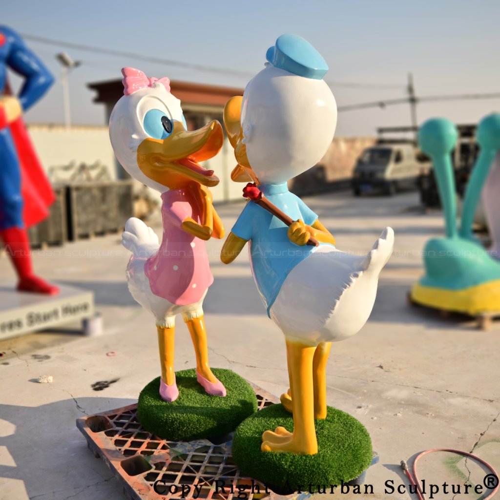 donald duck and daisy duck sculptures