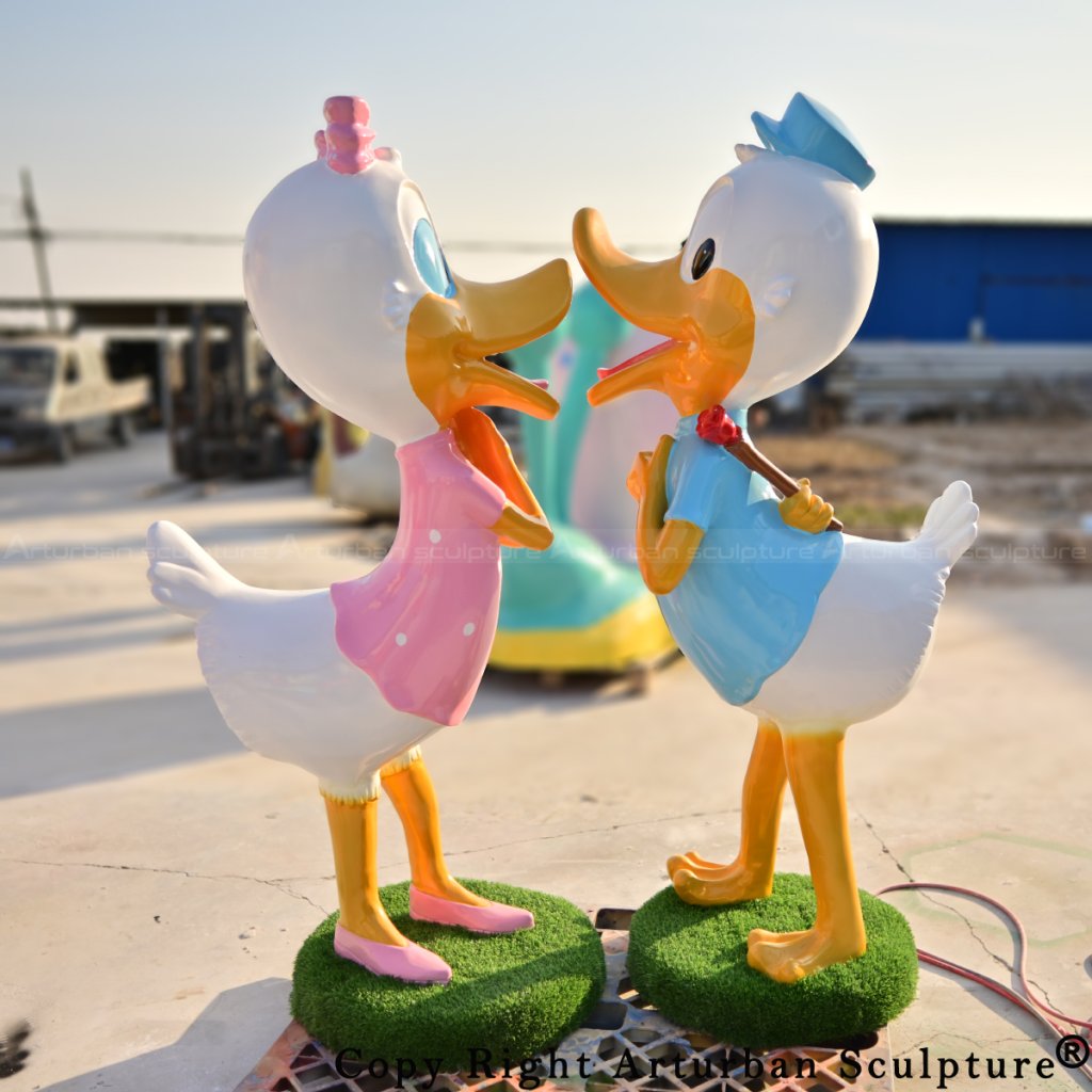 donald and daisy duck couple statues