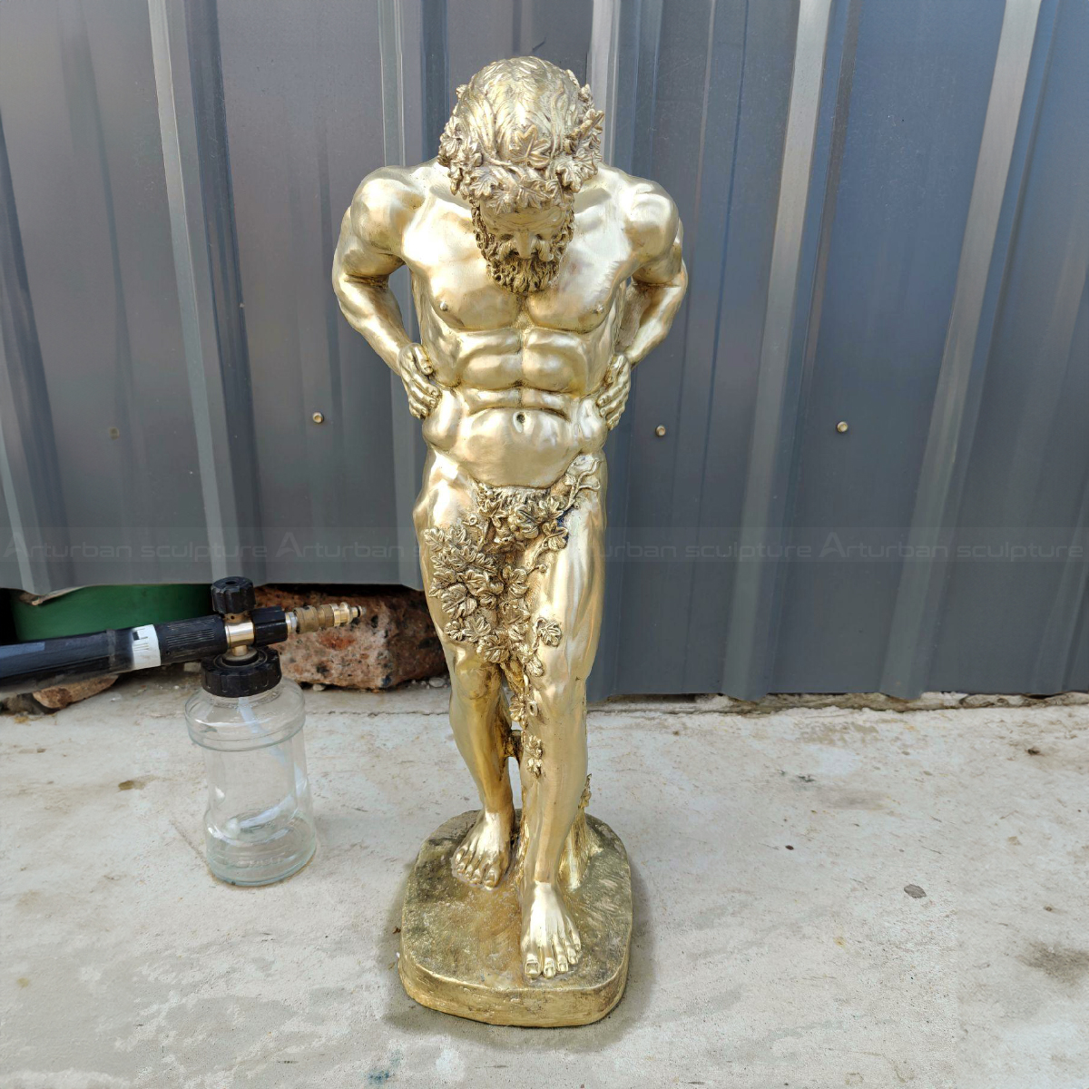 Dionysus Bacchus standing with head bowed and hands on hips bronze Statue