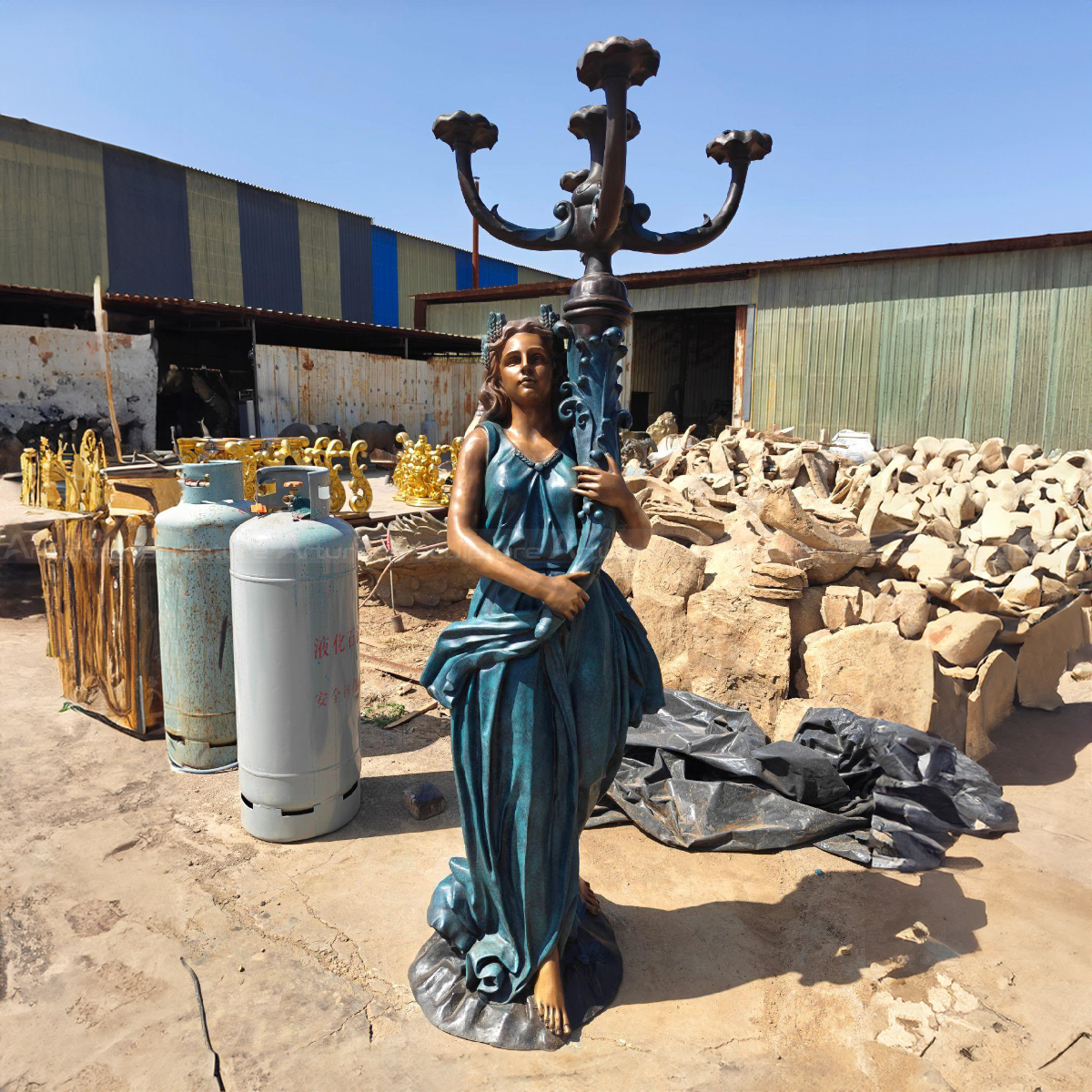 Lady Holding multi-branch candelabra Statue in a blue gown