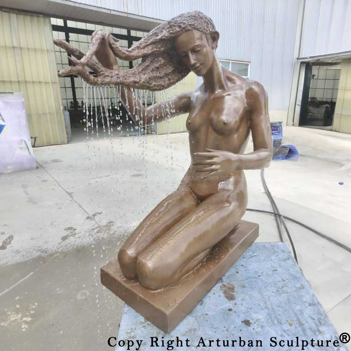 bronze lady washing hair statue