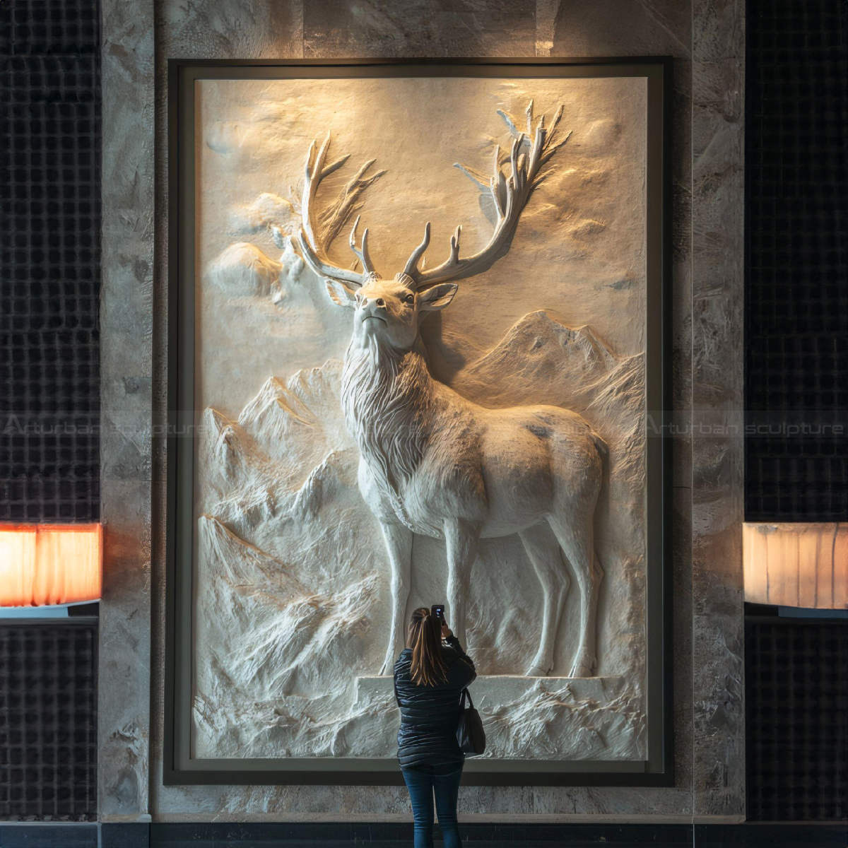 marble elk relief looking into the distance