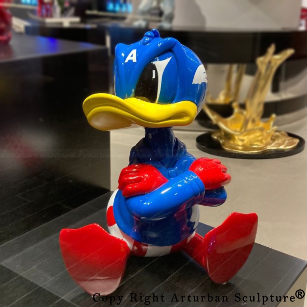 Donald Duck statue with crossed arms