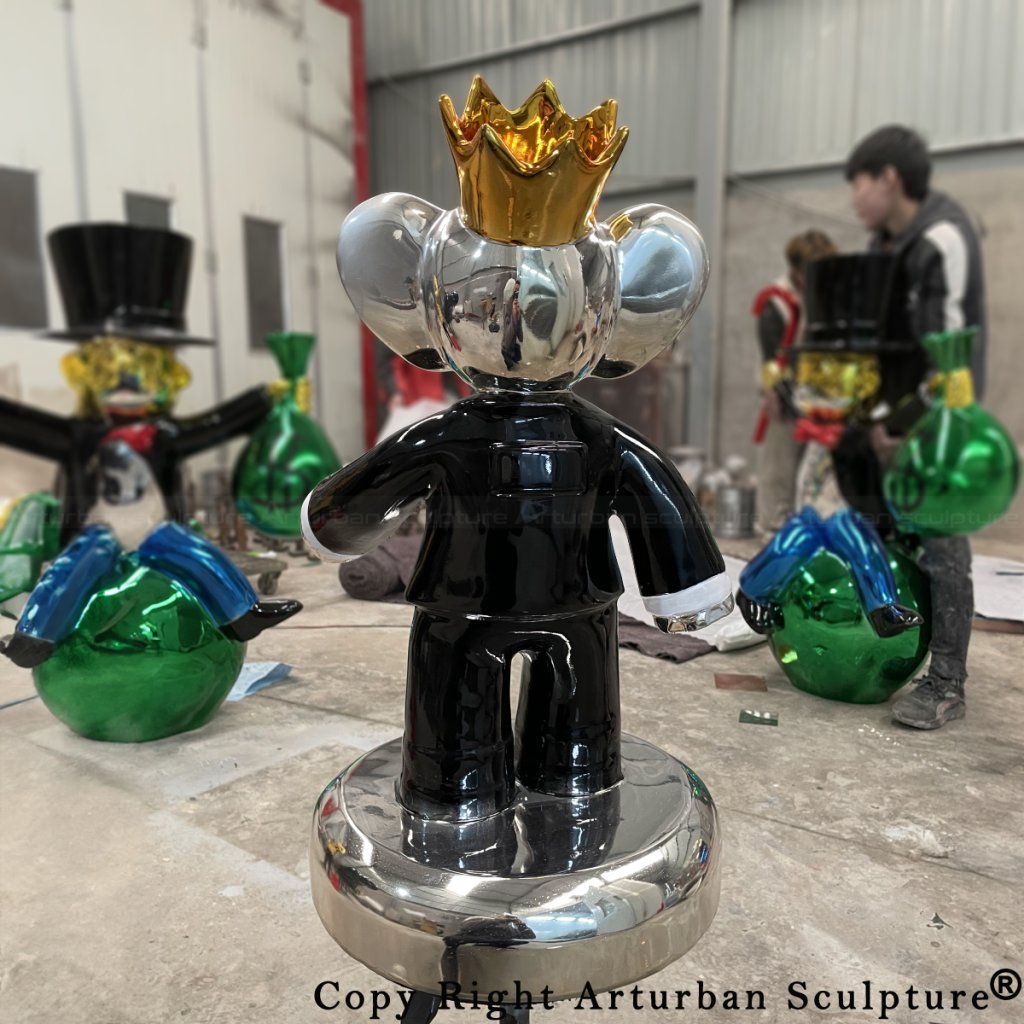 back view of Vincent Faudemer's Babolex sculpture showing elephant wearing back suit and golden crown