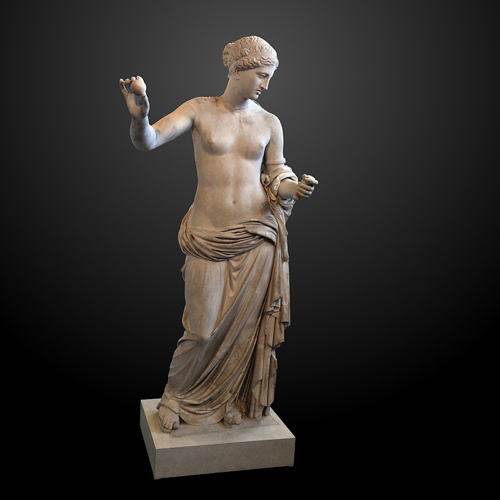 Semi-nude Venus statue holding an apple in her extended left hand