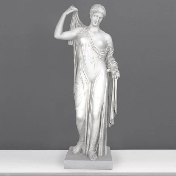 Venus Genetrix Type statue in flowing drapery, holding an apple in left hand