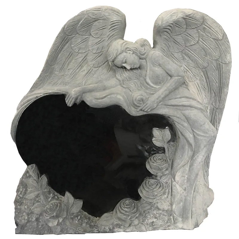 Angel and Heart Headstone sculpture half-lying on a heart-shaped gravestone