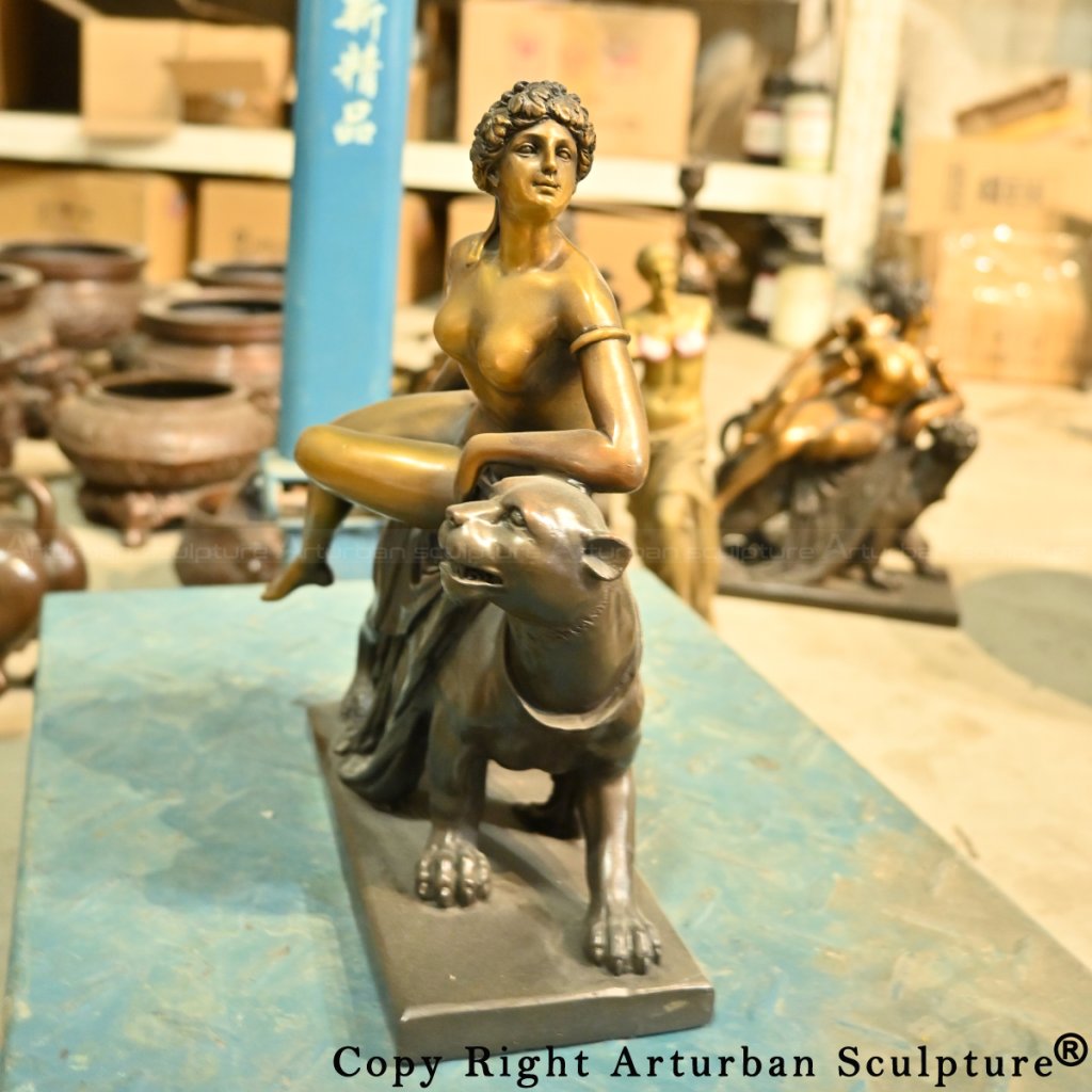 Ariadne on the Panther statue with one leg bent and the other resting
