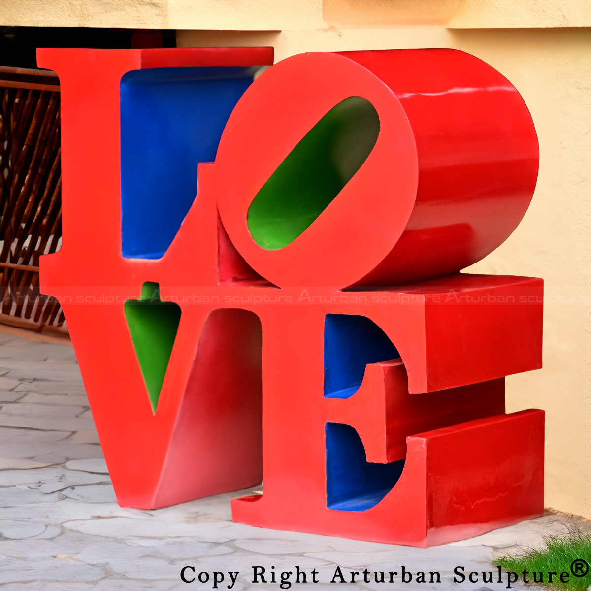 Artist of Love Sculpture with red exterior and green-blue inner sides