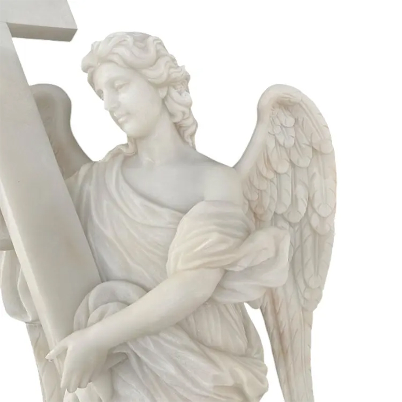 Close-up of Angel With Cross Statue showing fine marble carving details