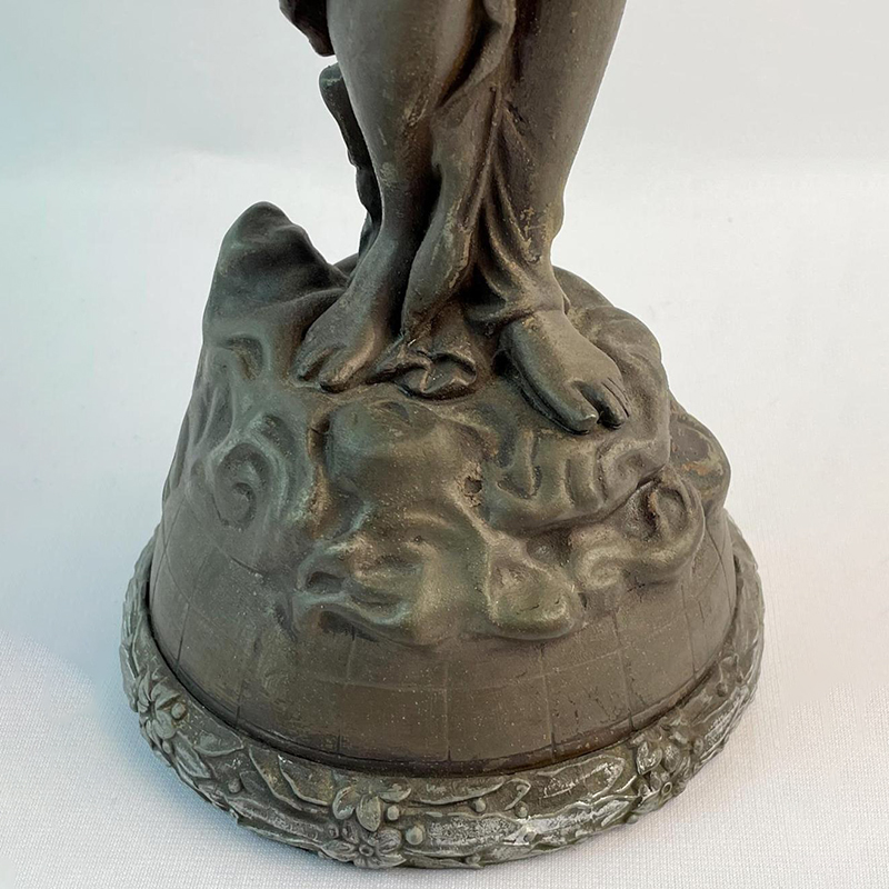 Close-up of the base of Musical Angel bronze Statue