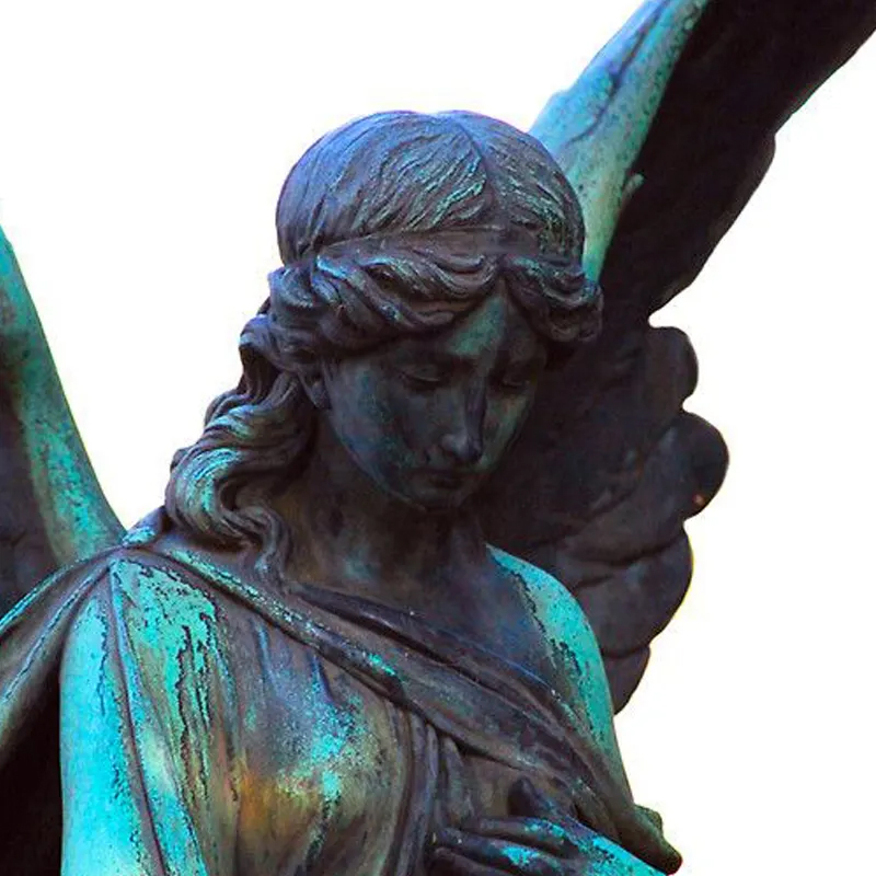 Close-up view Mourning Angel Statue with green patina