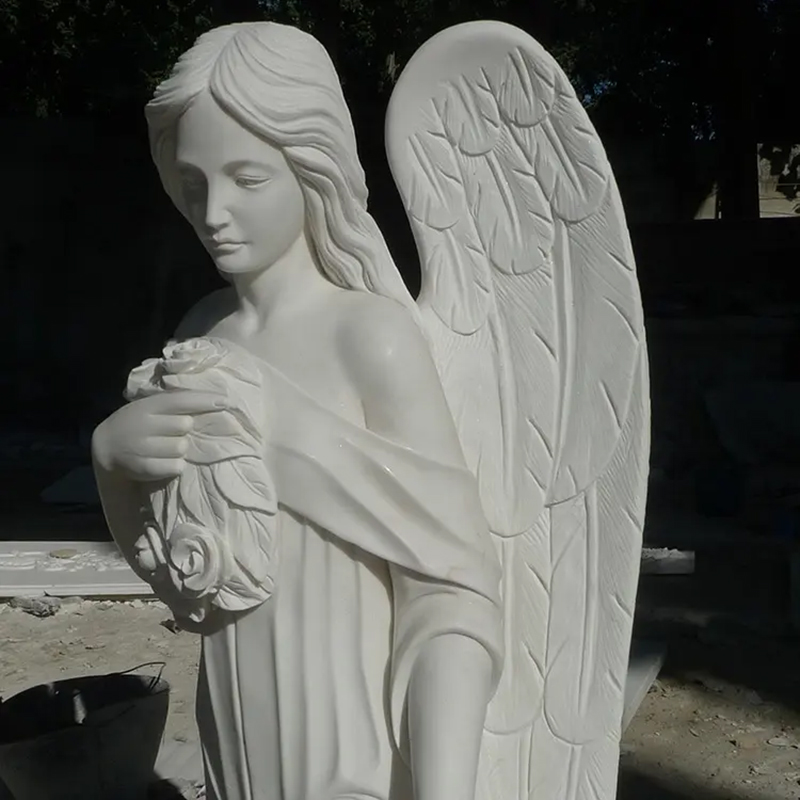 Close-up view of Cemetery Headstones with Angels with flowers