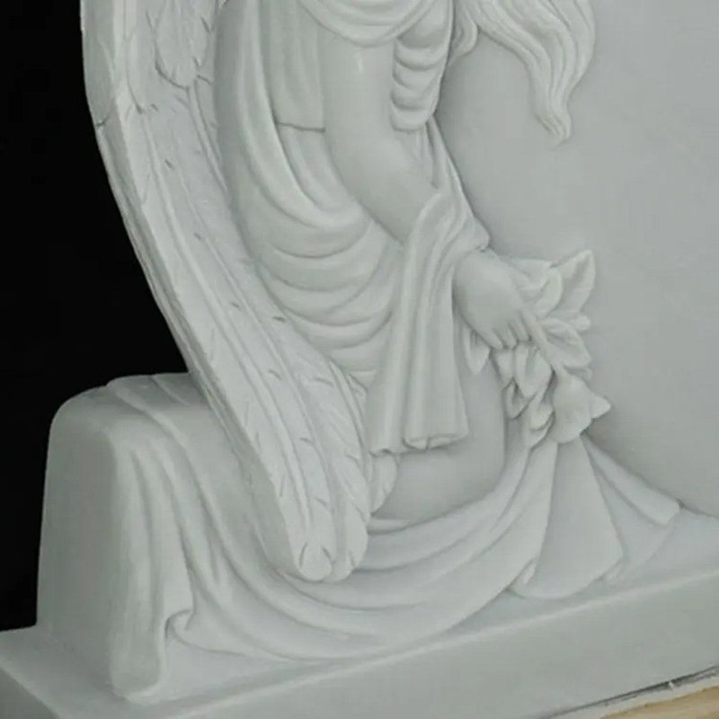 Detailed view of angel's hand holding flower