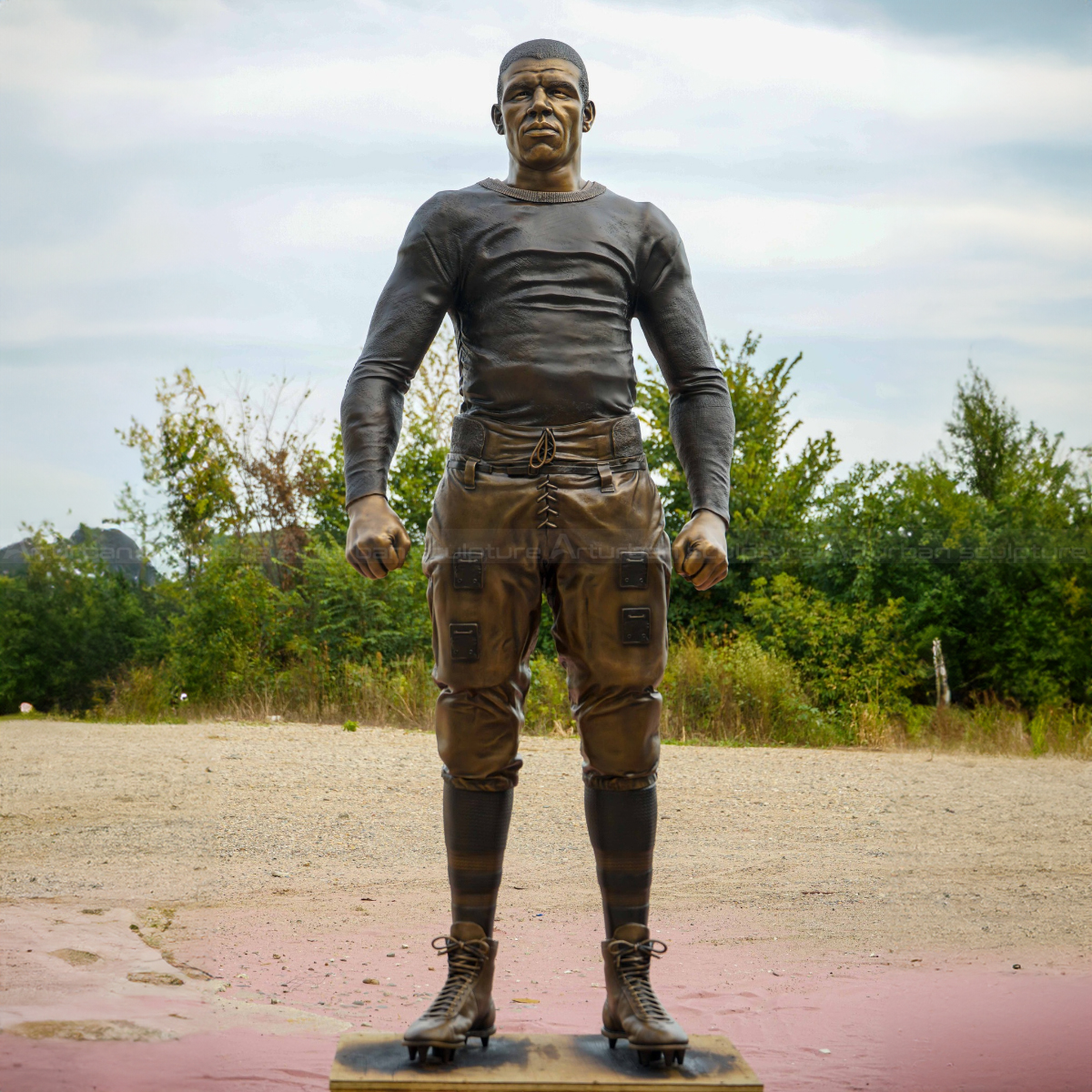Duke Slater Statue, standing with clenched fists