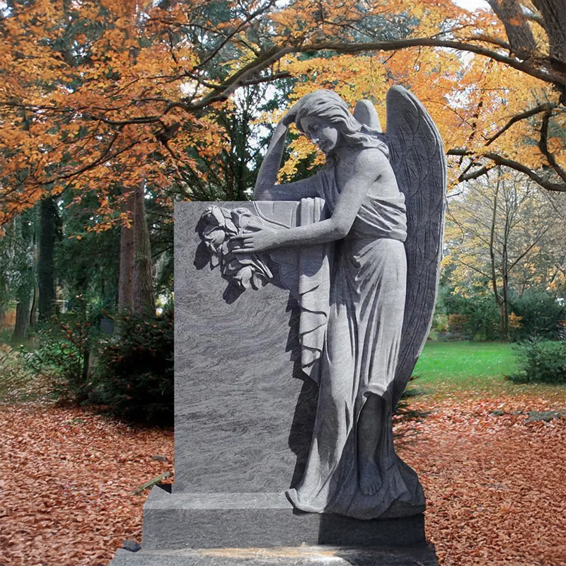 Granite Grieving Angel standing beside Tomestone Garden Statue